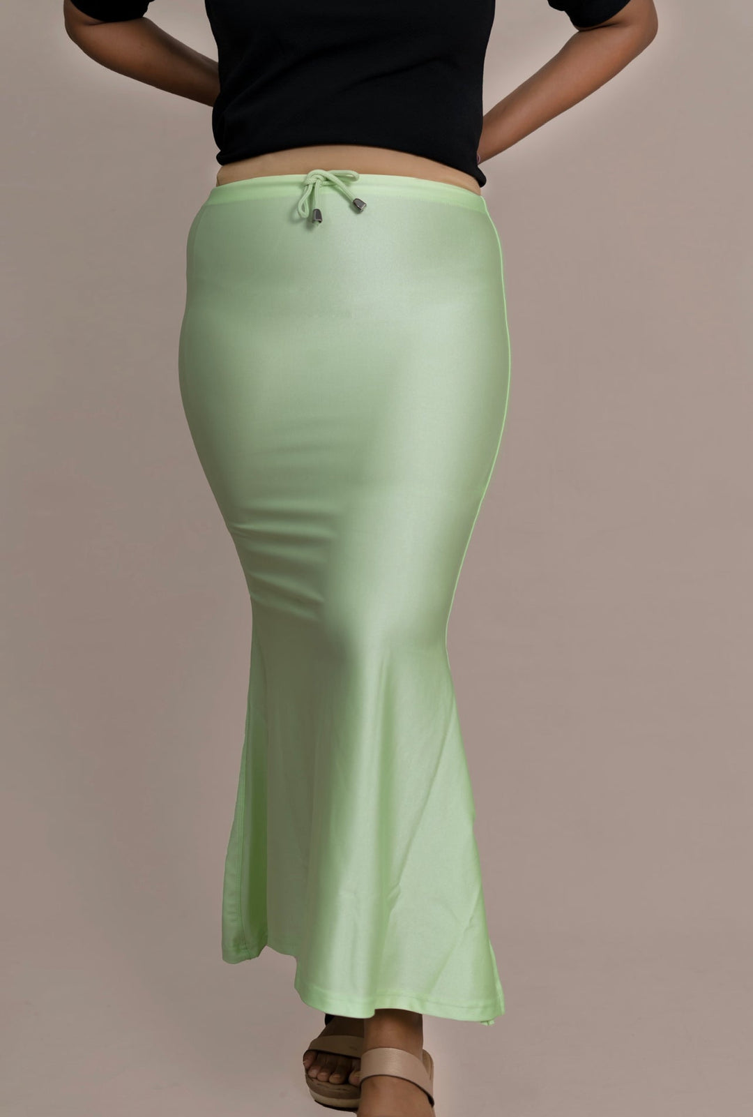 Mint buttersoft shimmer sareeshaper made of smooth, stretchy Lycra fabric with drawstring waist, designed for comfort and durability.