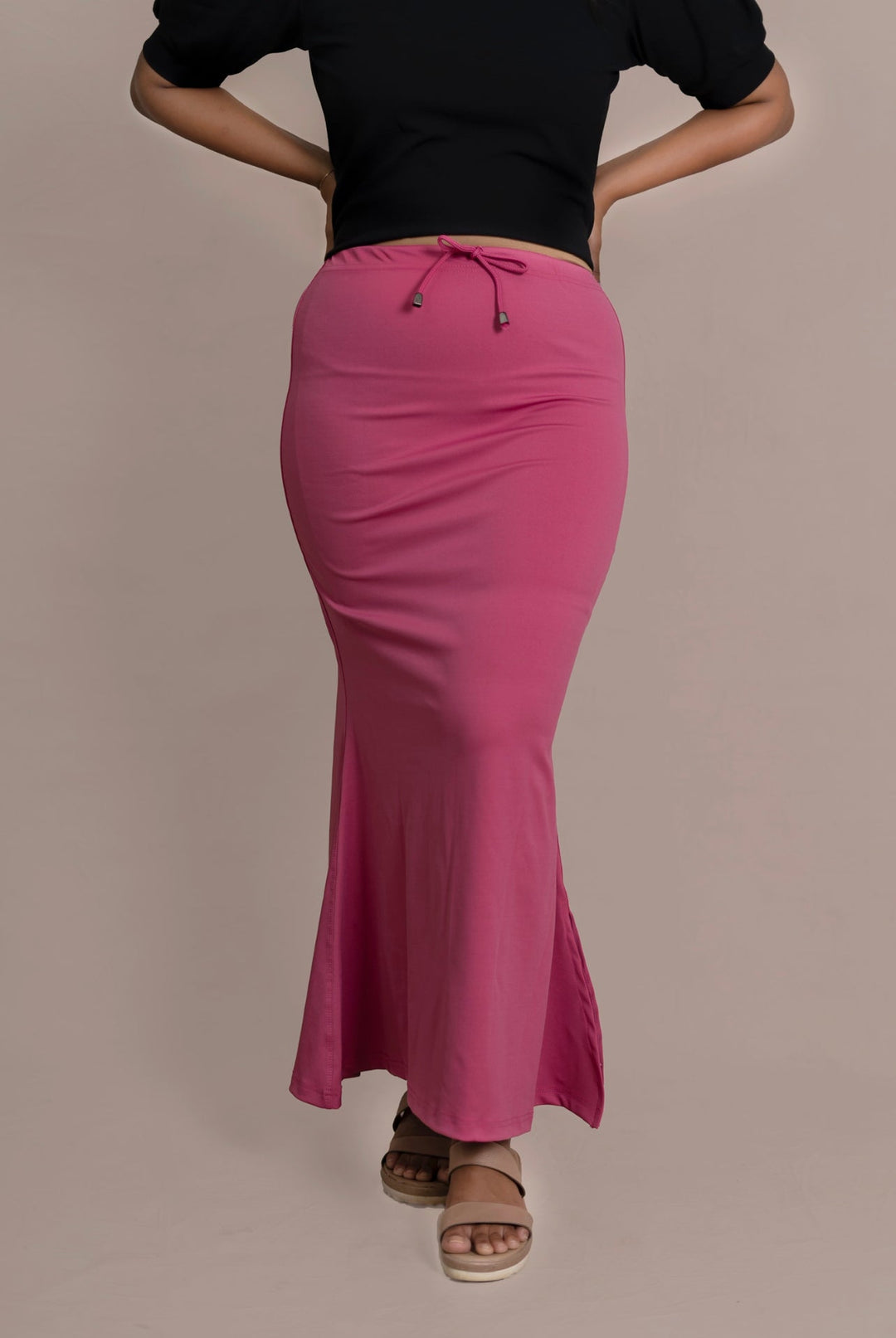 Mauve Samaya Sareeshaper with drawstring waist, soft four-way stretch fabric, and flare bottom, modeled with black top and sandals.