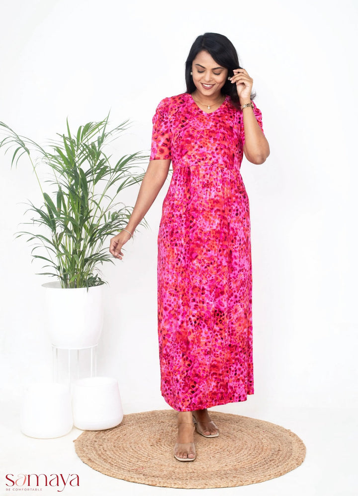 Luxury maxi pink lightweight floral nursing dress with V-neck and elbow puff sleeves, designed for maternity and easy breastfeeding access.