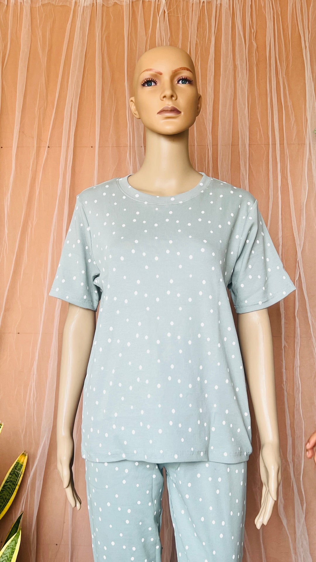 Ribbed sage pant set with relaxed fit, round neck, short sleeves, polka dot print, cotton fabric, and full-length pants.