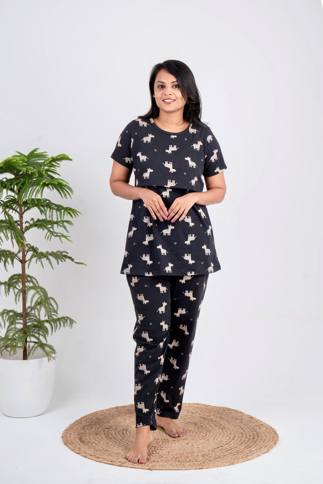 Lightweight giraffe print nursing pant set with short sleeves and round neck for comfortable feeding and lounging.