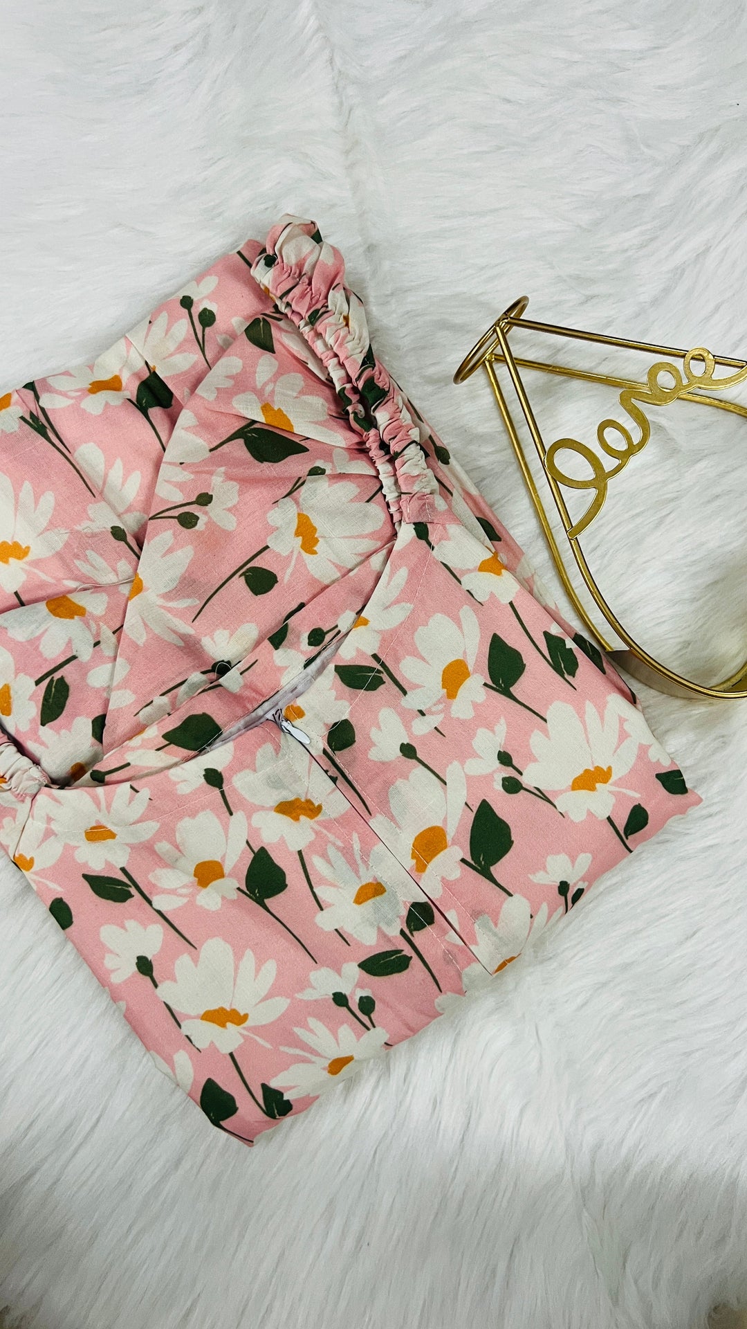 Pink floral Tara casual dress with sweetheart neckline, puff sleeves, and center zipper for nursing, made of lined cotton fabric.