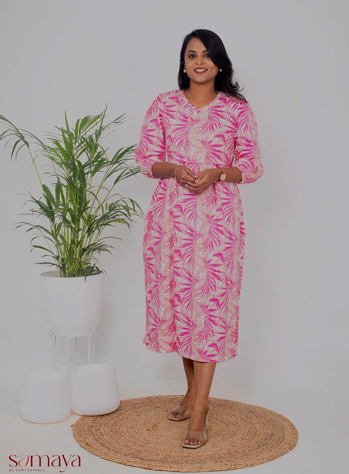 Midi baby pink floral print nursing dress with 3/4 sleeves and V-neck in soft cotton blend