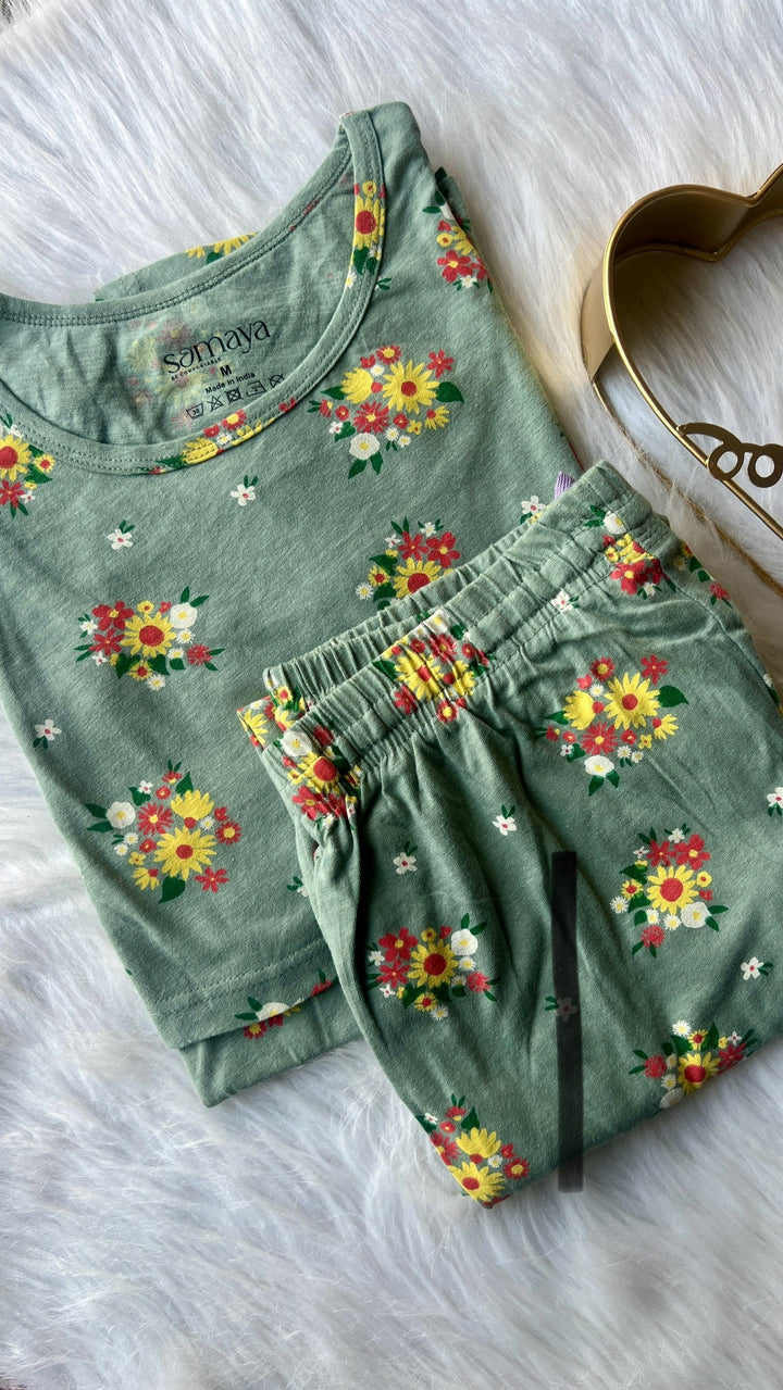 Sage green floral maternity nursing top and pants set with short sleeves and round neckline.