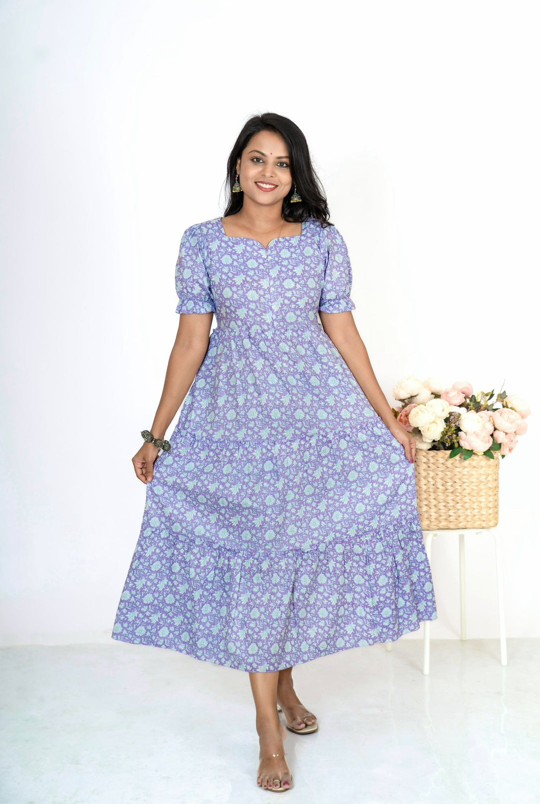 Lilac maternity feeding dress with floral print, elbow sleeves, and center zip for nursing access