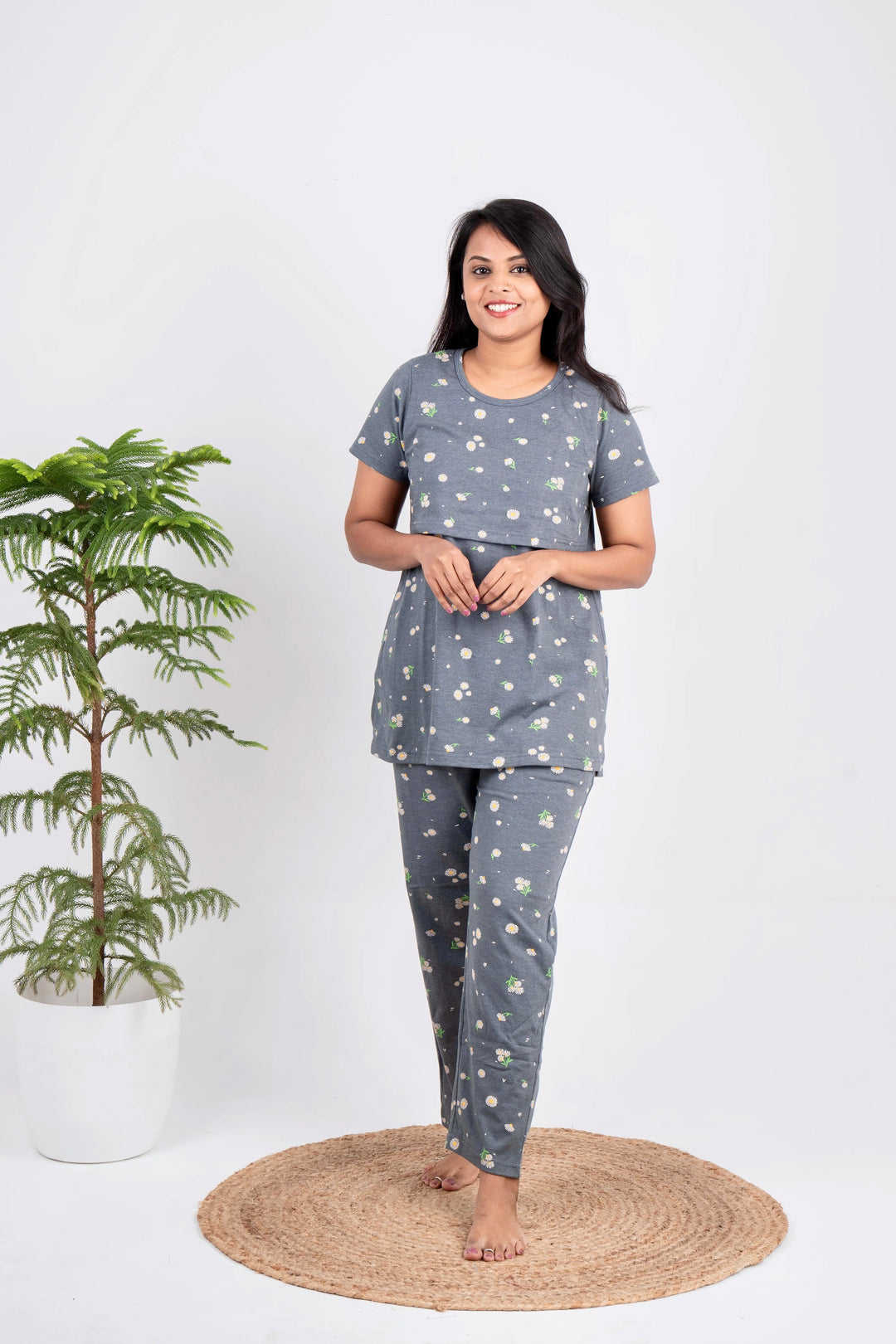 Woman wearing grey floral nursing pant set with short sleeves and round neck