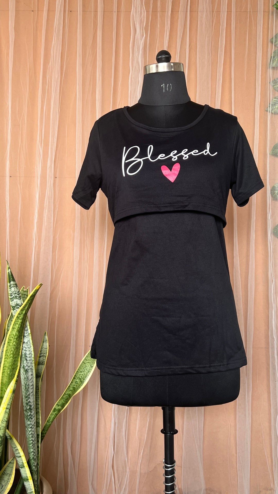 Black maternity blessed T-shirt with nursing flaps and oversized winter fit on mannequin