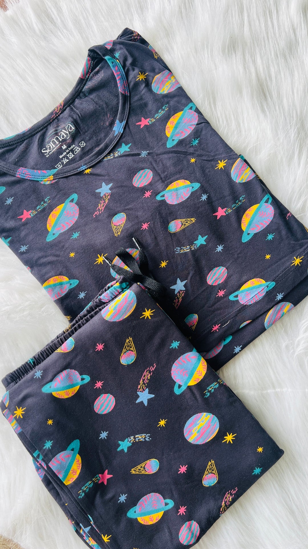 Planet nursing pant set in dark fabric with colorful planet and star prints, lightweight and comfortable maternity loungewear with nursing flap.