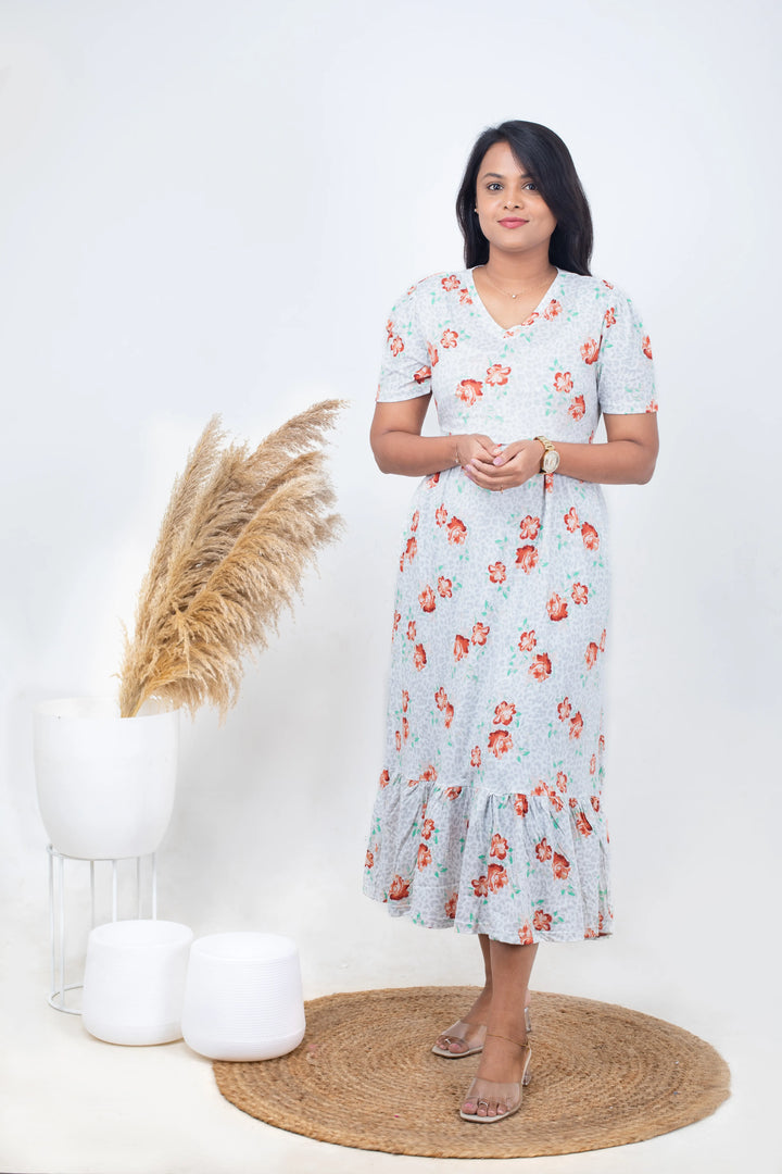 Calf length Amore lightweight floral nursing dress with V-neck and puff sleeves