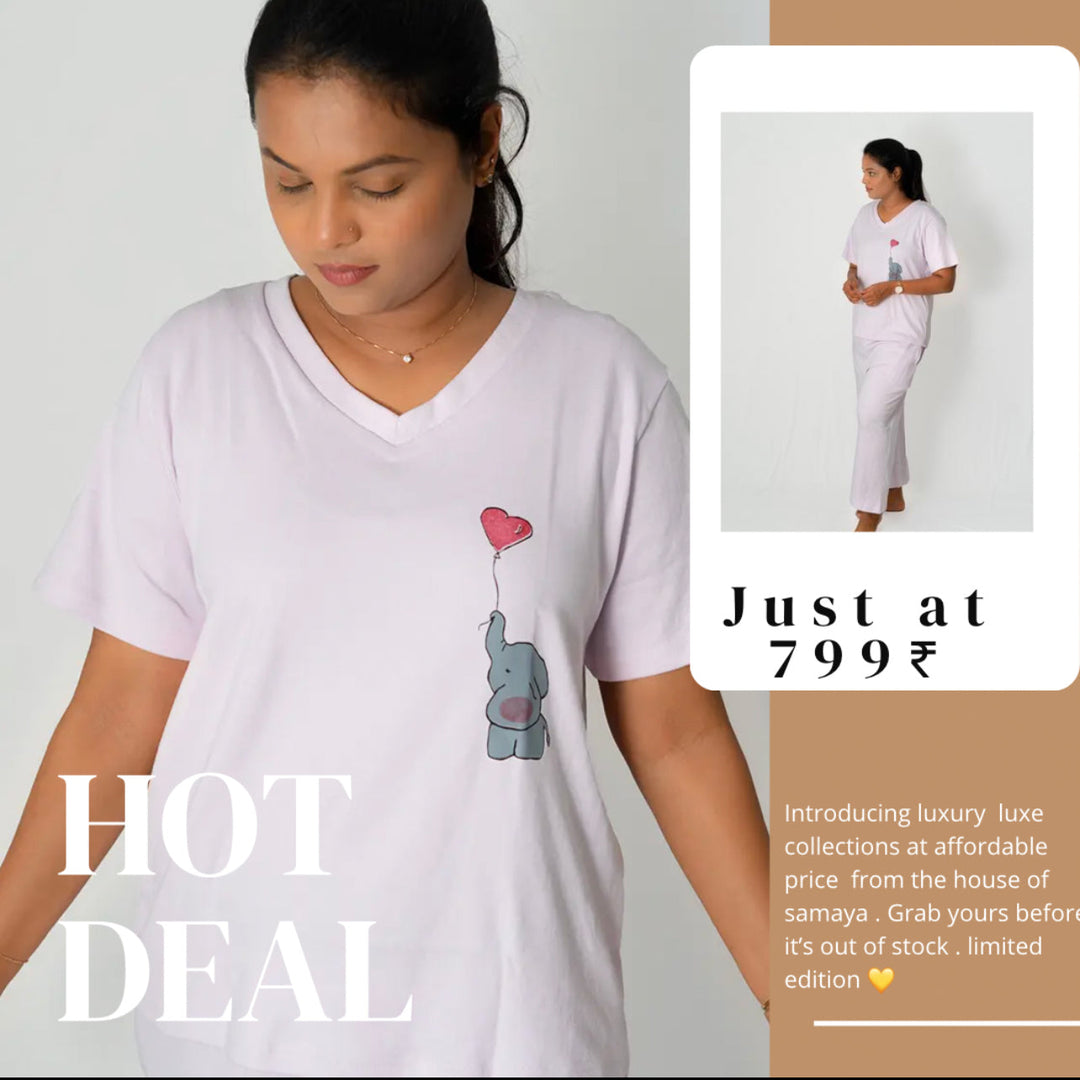 Woman wearing relaxed fit cotton Jumbo Pant Set with elephant and heart balloon print