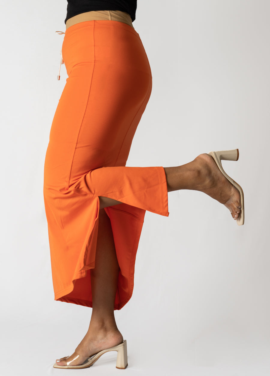 Orange Samaya Sareeshaper with side slit, soft stretchable fabric, and drawstring waist for comfortable fit and durability.